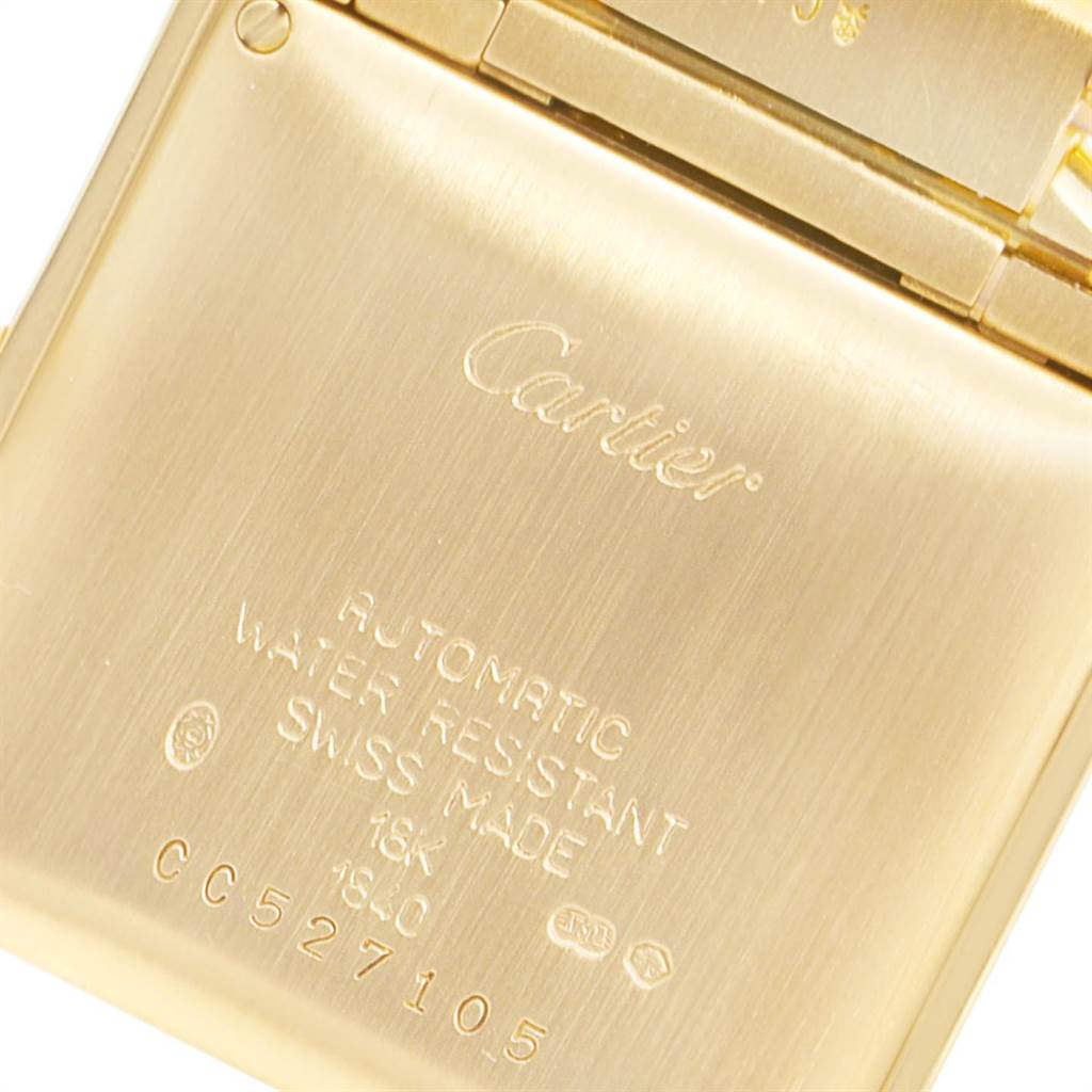 The image shows the back case of a Cartier Tank Française watch, highlighting engravings and inscriptions.