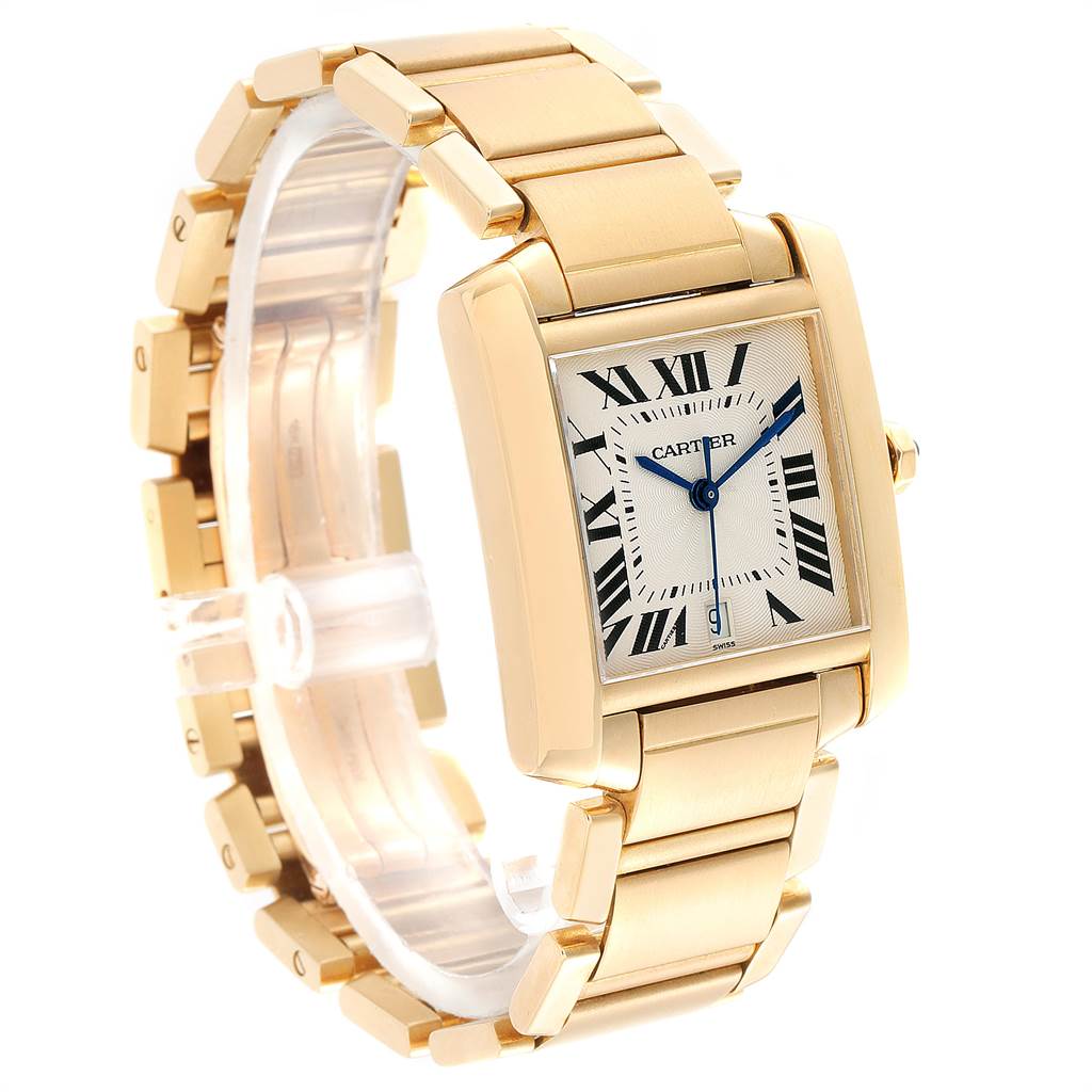 The Cartier Tank Française watch is shown in a three-quarter angle, highlighting its gold bracelet, rectangular case, and Roman numeral dial.