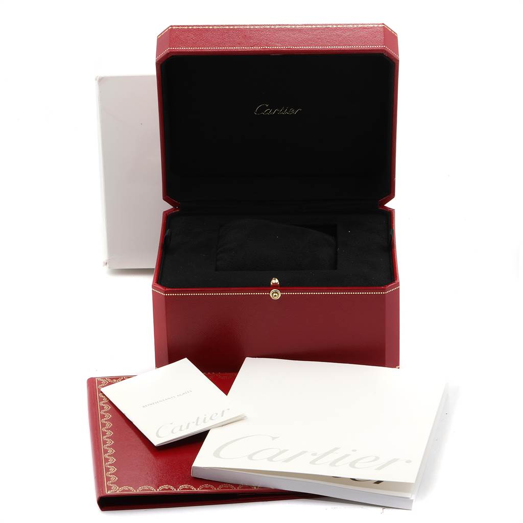The image shows an open Cartier watch box for the Tank Francaise model along with accompanying booklets.