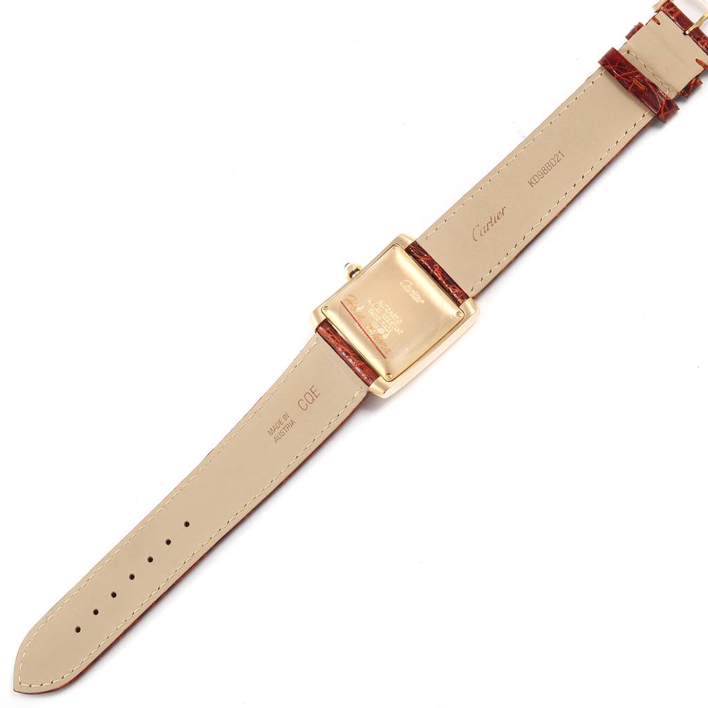 The image shows the back and strap of a Cartier Tank Française watch laid flat.