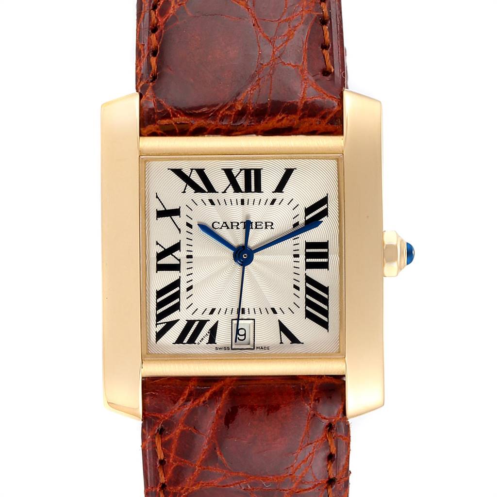 This image shows the face of a Cartier Tank Francaise W5000156 Yellow Gold Silver Dial W5000156 Yellow Gold Silver Dial watch, including the dial, roman numerals, hands, and part of the leather strap.