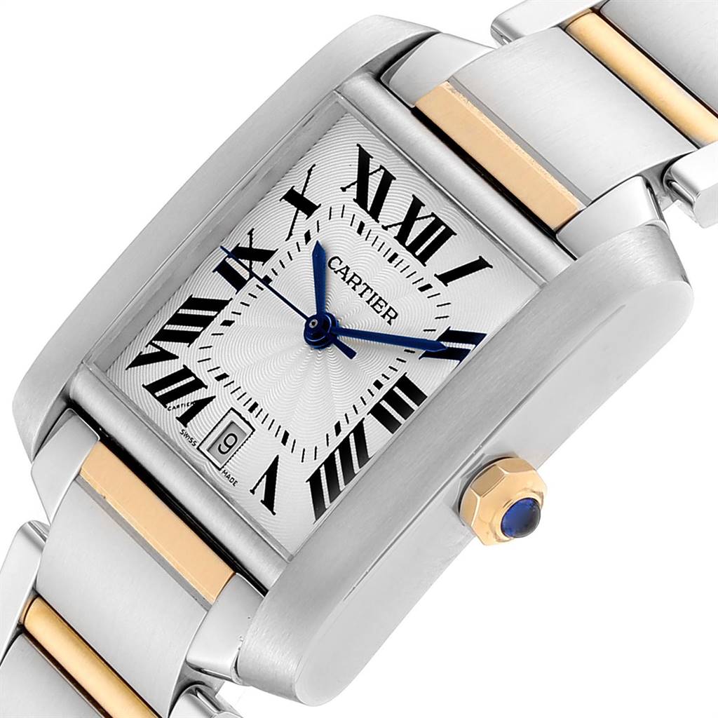 This image of the Cartier Tank Française watch shows a close-up of the dial, bracelet, and crown with a blue cabochon.