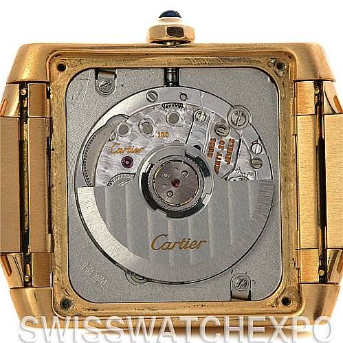 The image shows the back of a Cartier Tank Française watch, revealing its internal mechanical movement.