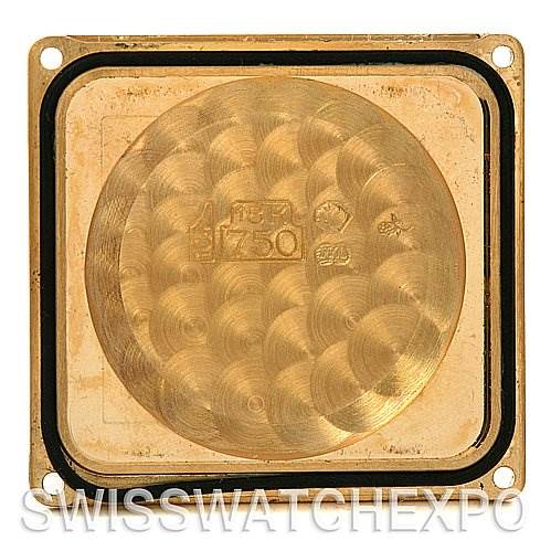 This image shows the inside case back of a Cartier Tank Française watch, highlighting the engravings and markings.