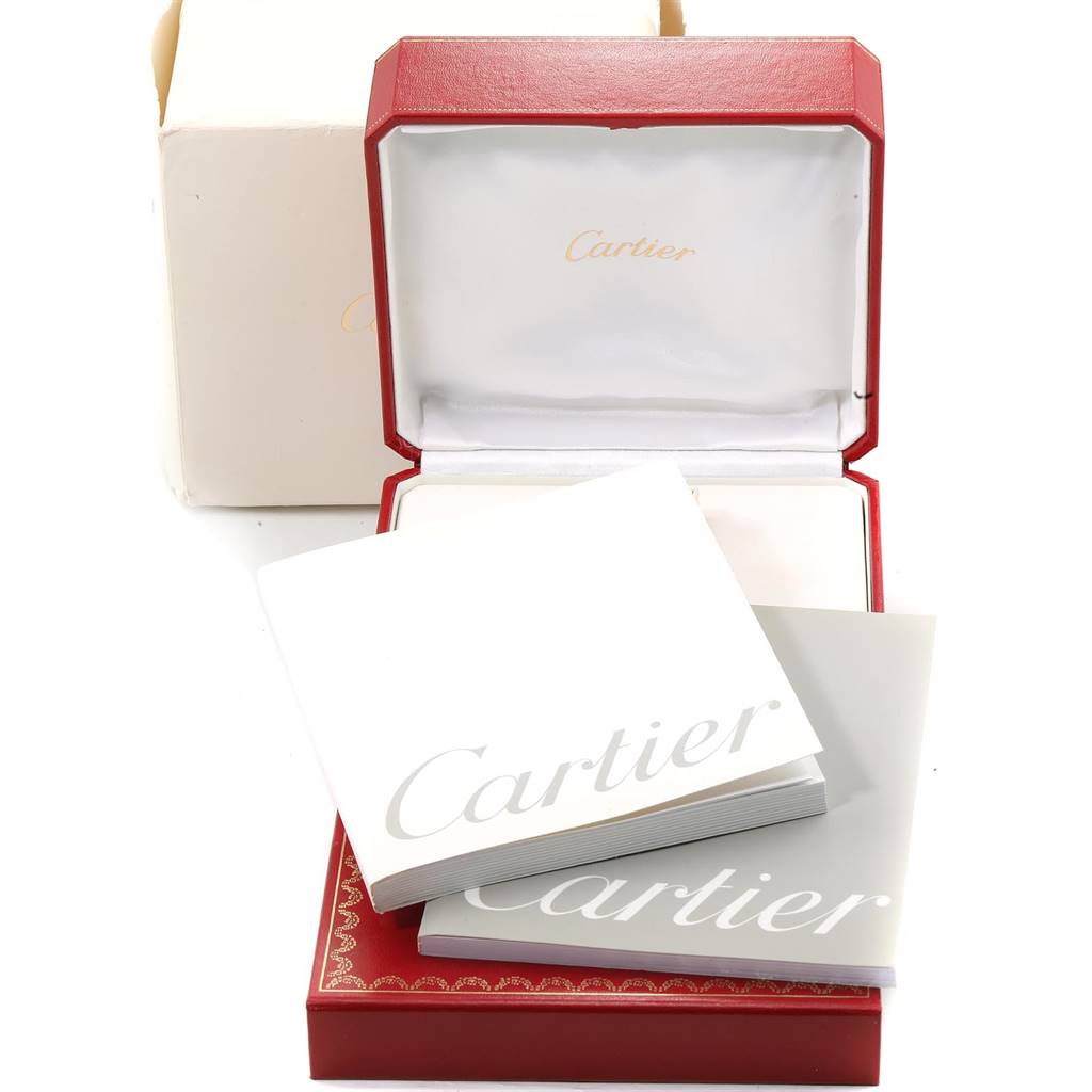 The image shows an open Cartier Tank Française watch box with accompanying manuals and outer packaging.