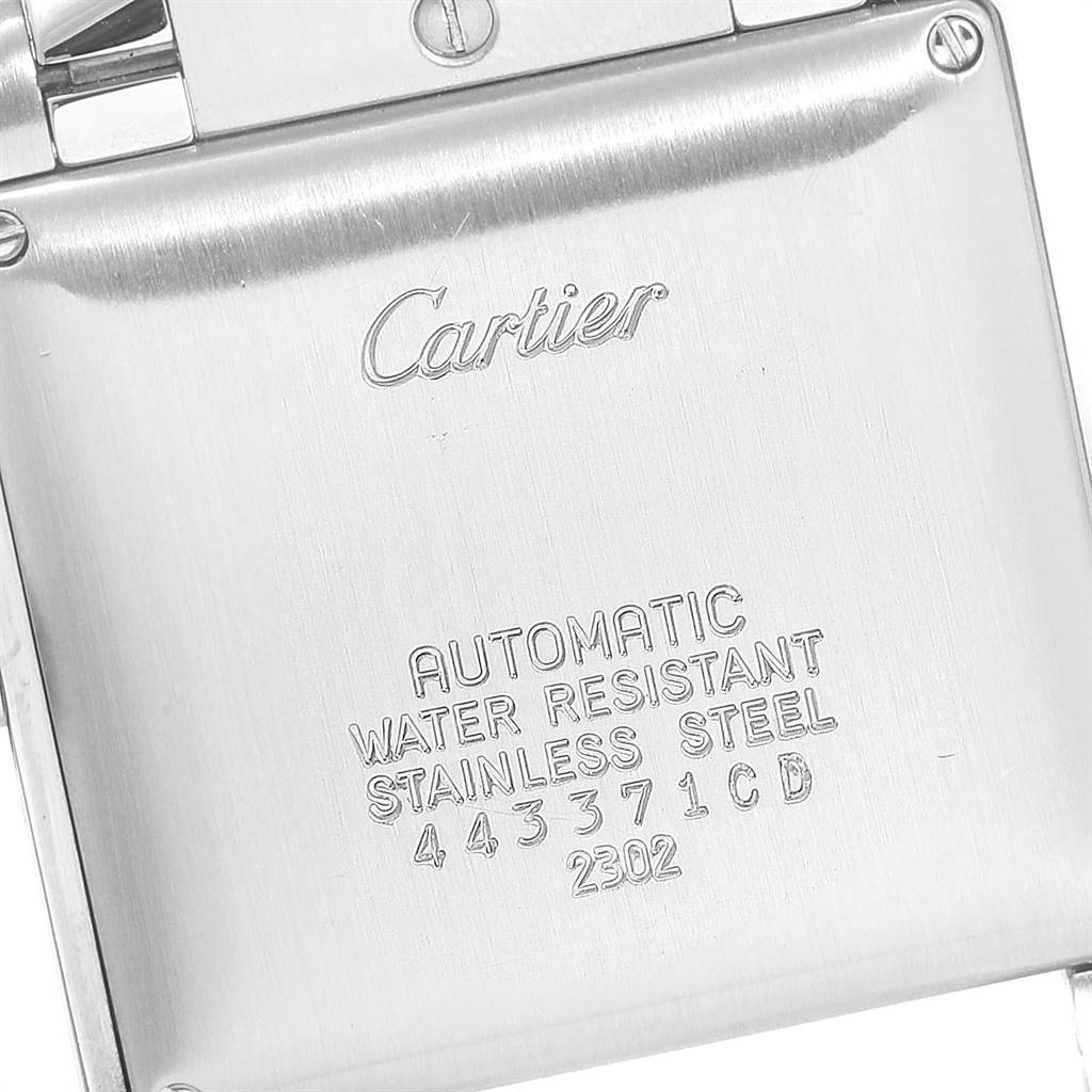 This image shows the back case of a Cartier Tank Francaise W51005Q4 Men's Steel and Gold (two tone) Silver Dial W51005Q4 Men's Steel and Gold (two tone) Silver Dial watch, highlighting the inscriptions and material details.