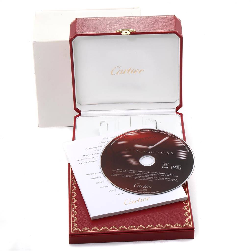 The image shows a Cartier Tank Francaise W51005Q4 Men's Steel and Gold (two tone) Silver Dial W51005Q4 Men's Steel and Gold (two tone) Silver Dial watch box containing a booklet and a DVD.