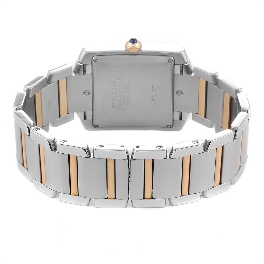 The image shows the back and bracelet of the Cartier Tank Française watch, highlighting its two-tone metal design.