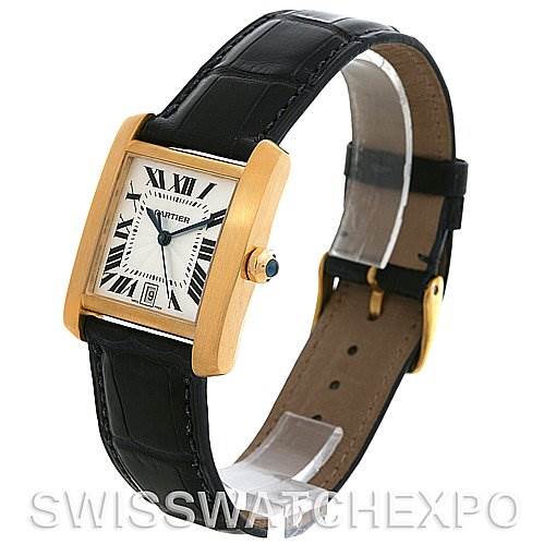 This is a side angle view of a Cartier Tank Francaise W5000156 Yellow Gold Silver Dial W5000156 Yellow Gold Silver Dial watch showing the face, leather strap, and crown.