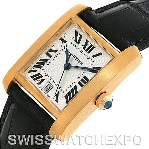 This image shows a Cartier Tank Francaise W5000156 Yellow Gold Silver Dial W5000156 Yellow Gold Silver Dial watch at an angle displaying the face, Roman numeral dial, date window, and crown with jewel.