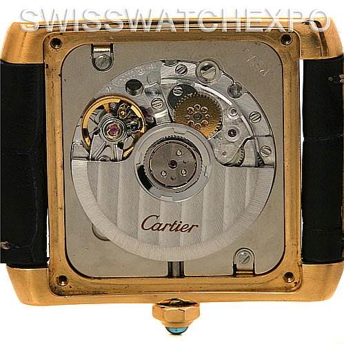 The image shows the back view of a Cartier Tank Francaise W5000156 Yellow Gold Silver Dial W5000156 Yellow Gold Silver Dial watch, revealing its internal mechanical movement.