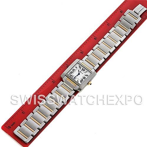 The image shows the full length of a Cartier Tank Francaise W51005Q4 Steel and Gold (two tone) Silver Dial W51005Q4 Steel and Gold (two tone) Silver Dial watch, placed next to a red ruler for scale.