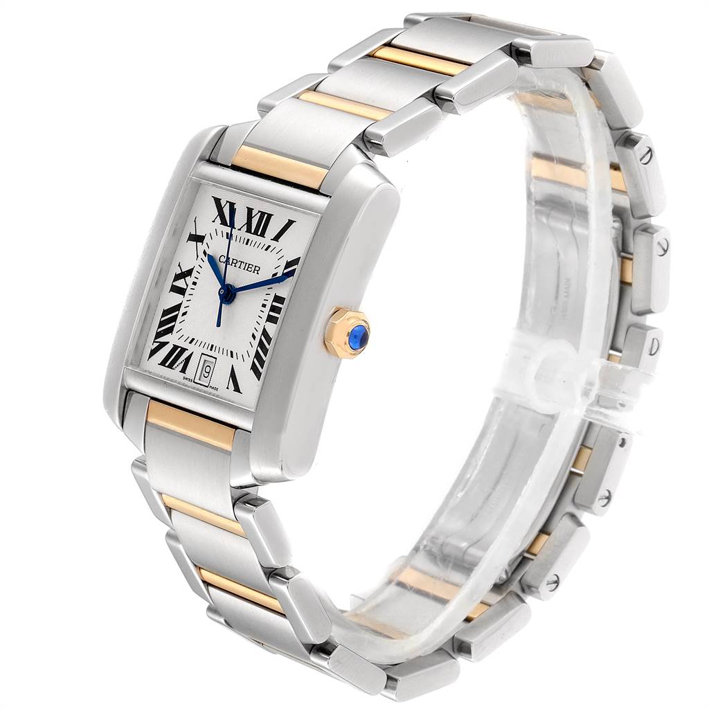 The image shows a Cartier Tank Francaise W51005Q4 Men's Steel and Gold (two tone) Silver Dial W51005Q4 Men's Steel and Gold (two tone) Silver Dial watch angled to display its face, metal bracelet, and side crown with a blue gem.