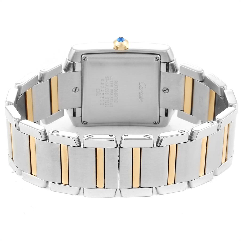 This image shows the back view of a Cartier Tank Française watch, highlighting its stainless steel and gold bracelet and case back.