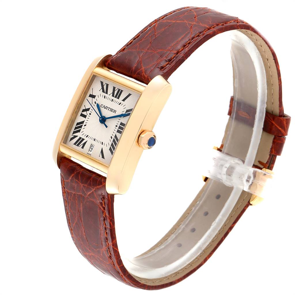 The image shows a Cartier Tank Francaise W5000156 Men's Yellow Gold Silver Dial W5000156 Men's Yellow Gold Silver Dial watch at a slight angle, featuring its rectangular face, roman numerals, blue hands, and leather strap.