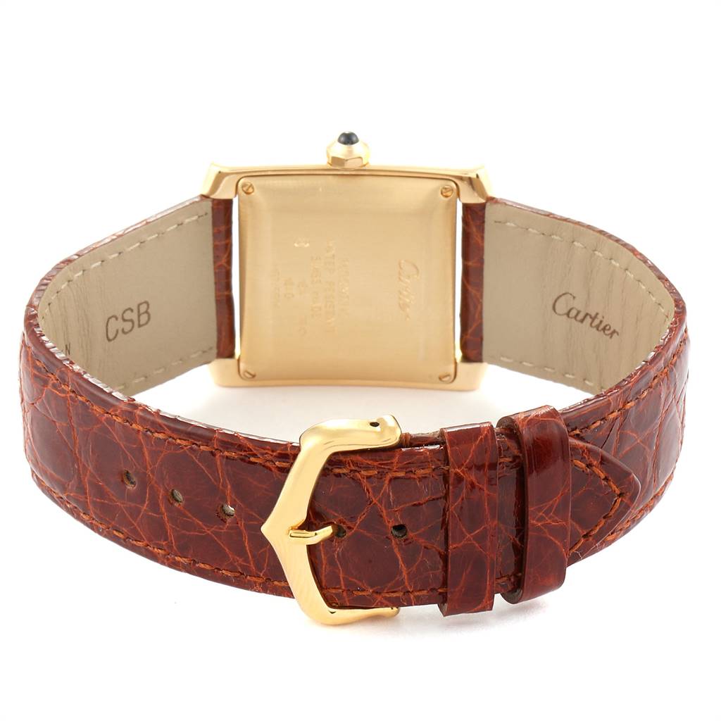 The image shows the back view of a Cartier Tank Francaise W5000156 Men's Yellow Gold Silver Dial W5000156 Men's Yellow Gold Silver Dial watch, highlighting the leather strap and clasp.