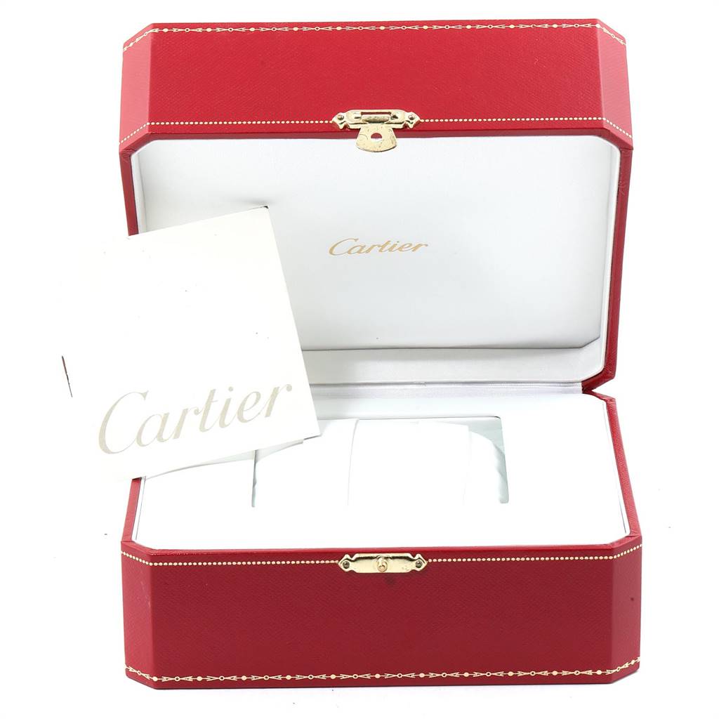 The image shows the open case and manual for a Cartier Tank Francaise W5000156 Men's Yellow Gold Silver Dial W5000156 Men's Yellow Gold Silver Dial watch, with a red box and a white interior.