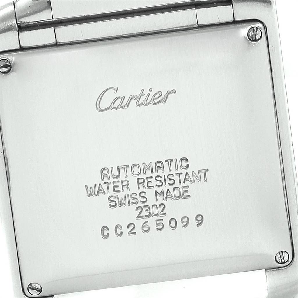 This is the back view of a Cartier Tank Francaise W51005Q4 Men's Steel and Gold (two tone) Silver Dial W51005Q4 Men's Steel and Gold (two tone) Silver Dial watch, showing inscriptions and screws.