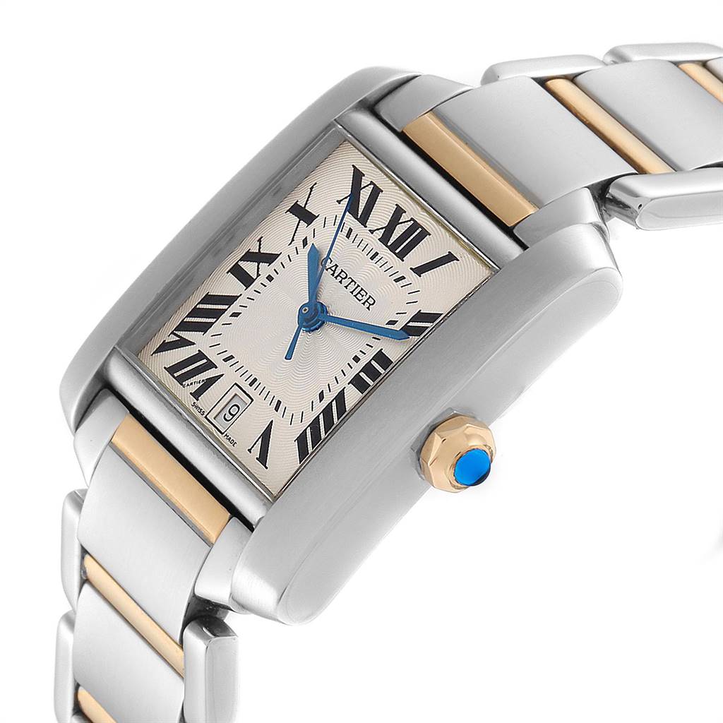 The image shows a side angle of a Cartier Tank Française watch, highlighting its rectangular face, Roman numerals, two-tone metal strap, and crown.