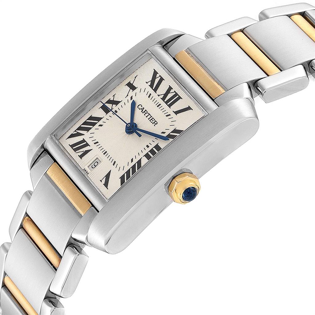 The image shows a close-up angled view of a Cartier Tank Française watch, highlighting its face, crown, and part of the bracelet.
