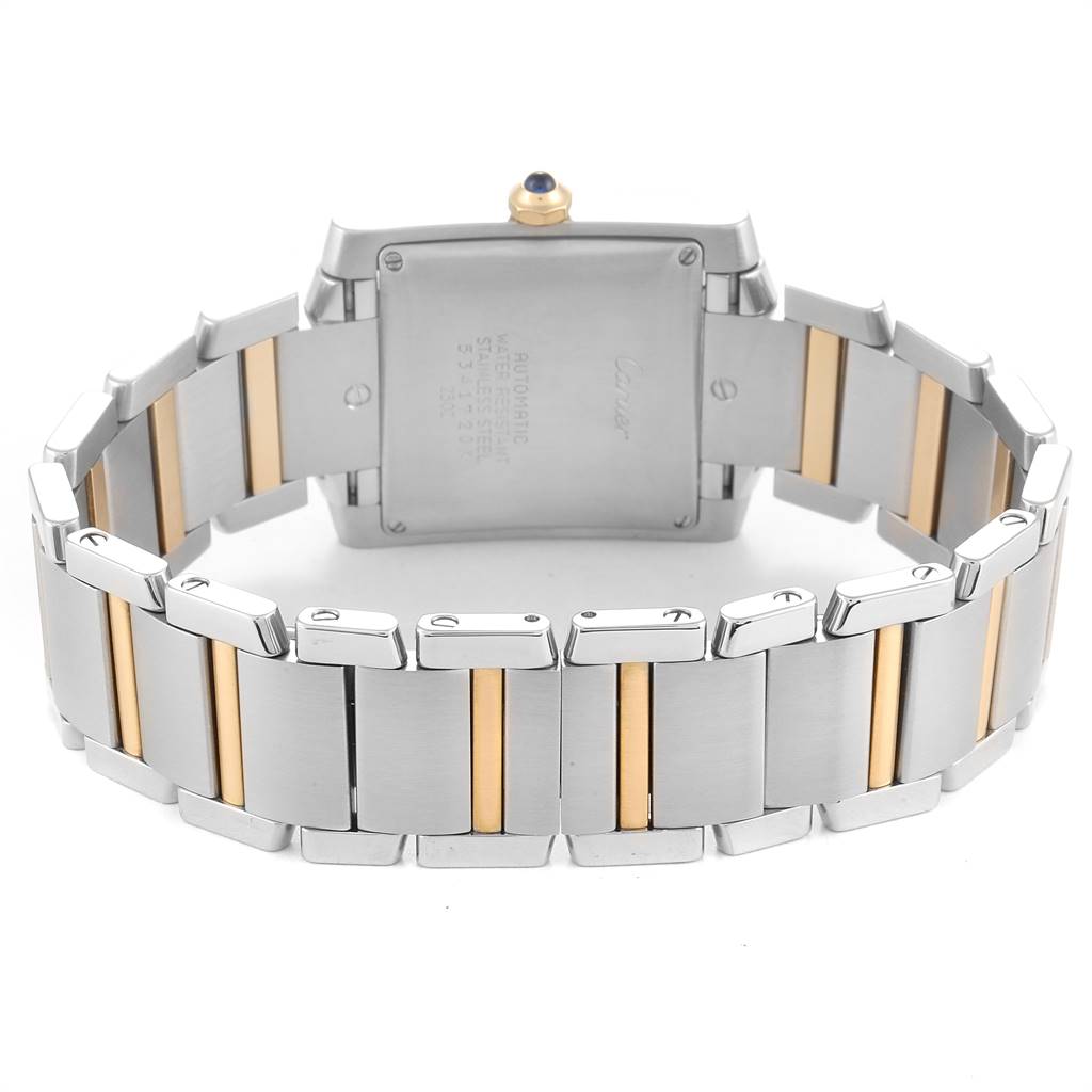 The image shows the back view of a Cartier Tank Française watch, highlighting the two-tone metal bracelet and case back.