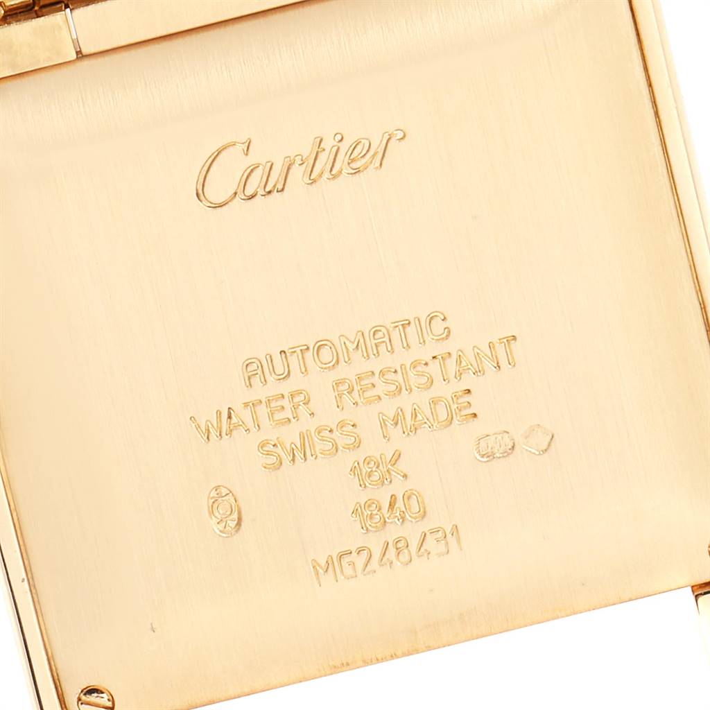This image shows the engraved back case of a Cartier Tank Francaise W50001R2 Yellow Gold Silver Dial W50001R2 Yellow Gold Silver Dial watch, detailing its specifications.