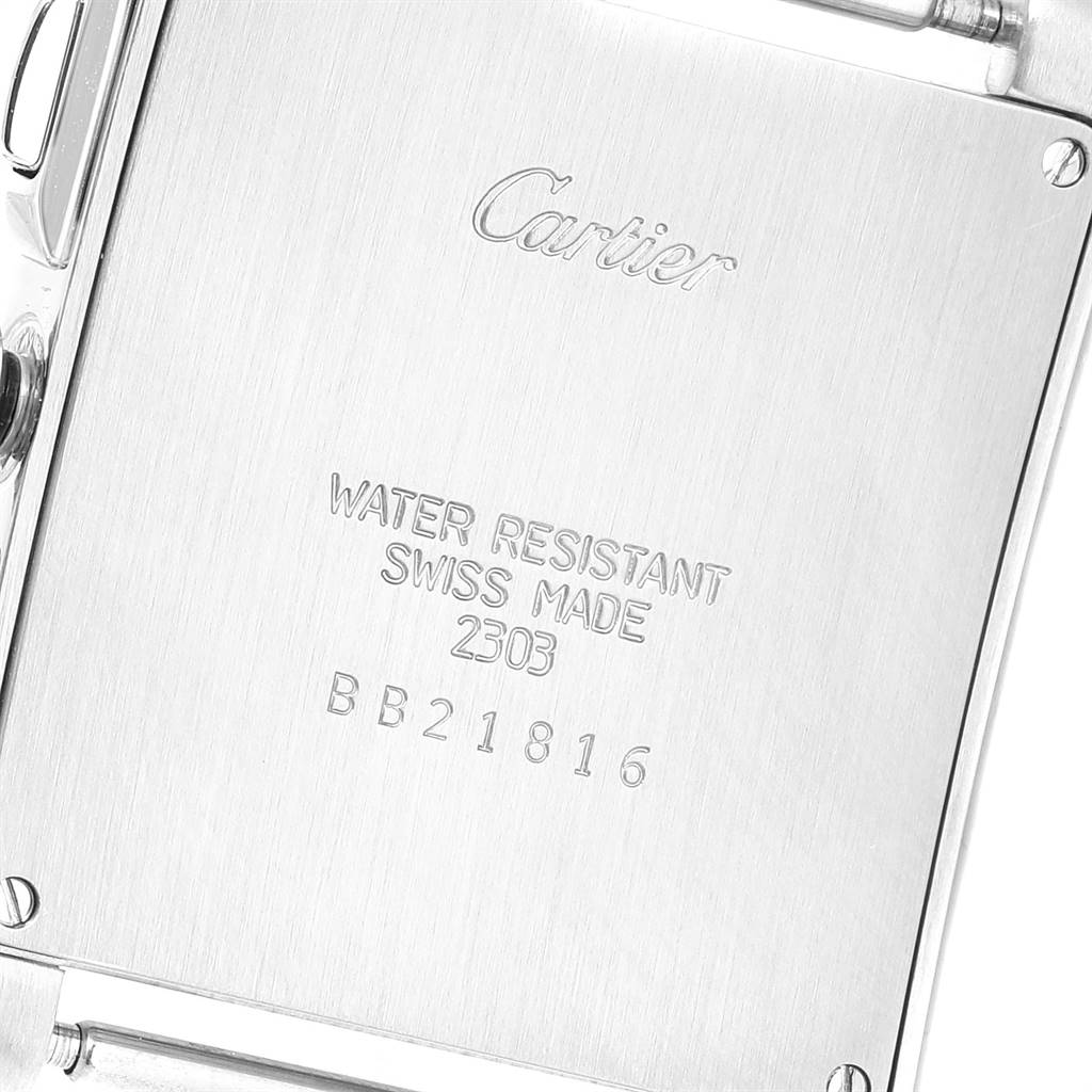 The image shows the back case of a Cartier Tank Française watch, highlighting its water resistance, Swiss origin, and serial number.