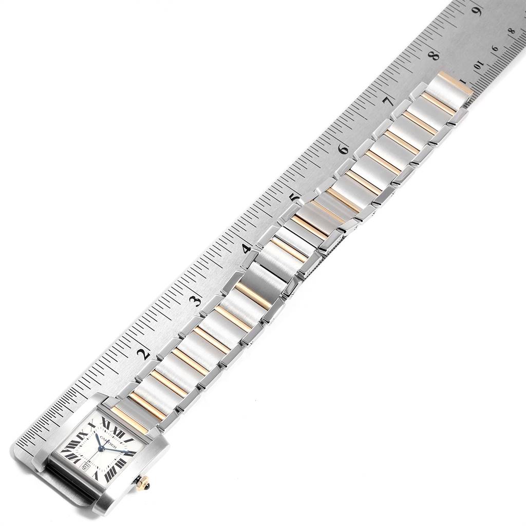 The Cartier Tank Francaise W51005Q4 Steel and Gold (two tone) Silver Dial W51005Q4 Steel and Gold (two tone) Silver Dial watch is shown from a top-down angle with the band measured against a ruler.