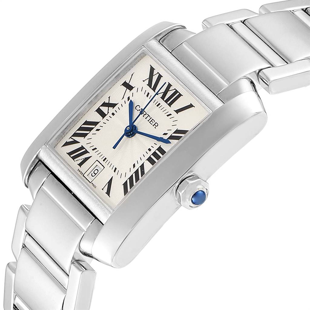 The image shows a close-up angle of the Cartier Tank Francaise W50011S3 Men's White Gold Silver Dial W50011S3 Men's White Gold Silver Dial watch, highlighting the Roman numeral dial, blue hands, crown with sapphire, and metal bracelet.