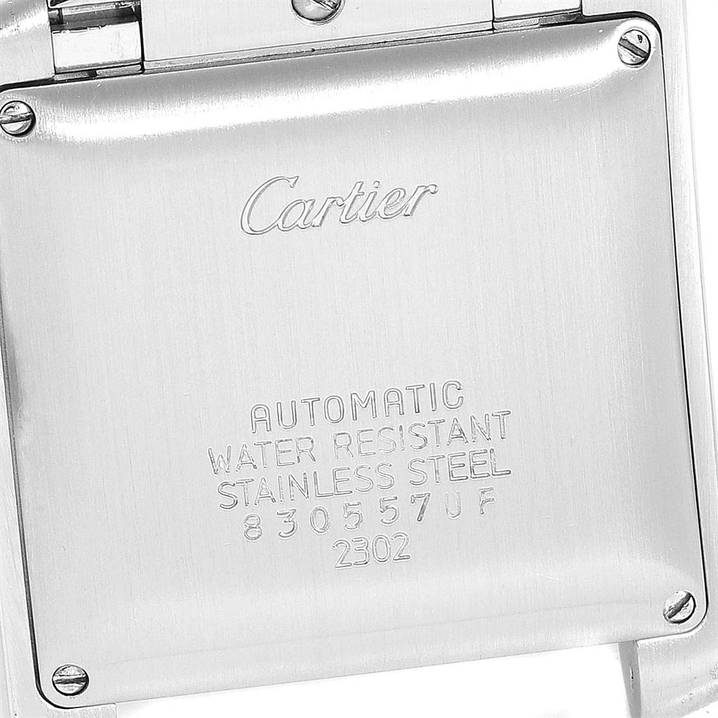 This image shows the backplate of a Cartier Tank Française watch, highlighting the brand name and specifications.