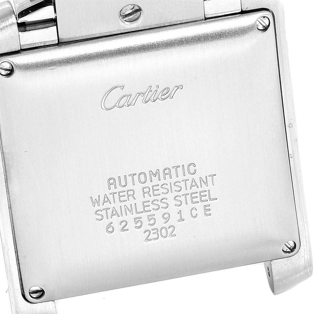 This image shows the back case of a Cartier Tank Française watch, highlighting its engravings.
