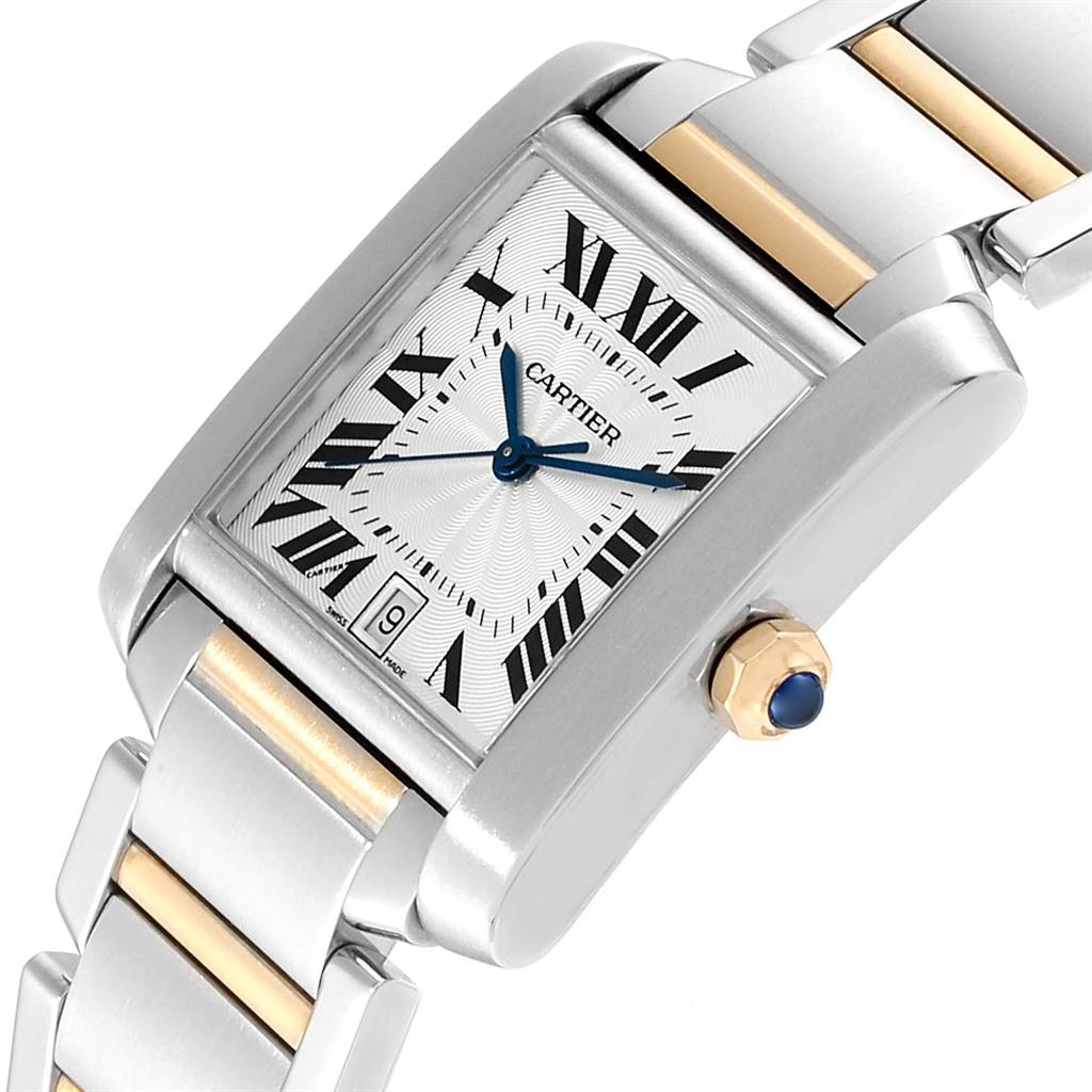 The image shows a Cartier Tank Francaise W51005Q4 Men's Steel and Gold (two tone) Silver Dial W51005Q4 Men's Steel and Gold (two tone) Silver Dial watch from an angled view, highlighting the rectangular face, crown with blue cabochon, and metal bracelet.