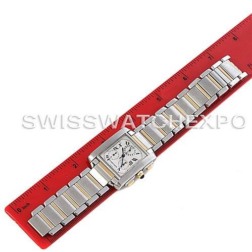 This image shows a top-down view of a Cartier Tank Francaise W51004Q4 Men's Steel and Gold (two tone) Silver Dial W51004Q4 Men's Steel and Gold (two tone) Silver Dial watch, including the face and bracelet, alongside a red ruler for scale.