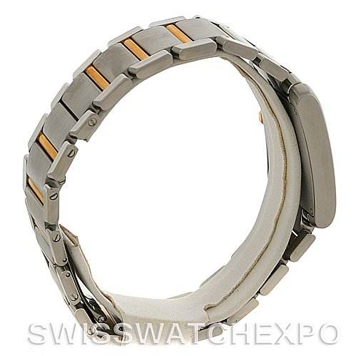 The image shows the side view of the bracelet and clasp of a Cartier Tank Francaise W51004Q4 Men's Steel and Gold (two tone) Silver Dial W51004Q4 Men's Steel and Gold (two tone) Silver Dial watch, highlighting the stainless steel and gold links.