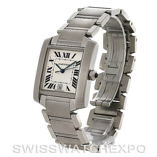 The image shows a Cartier Tank Française watch at a three-quarter angle, highlighting its rectangular face, bracelet, and crown with a blue cabochon.