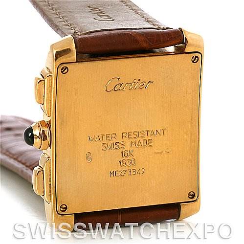 This image shows the back case of a Cartier Tank Francaise W5000556 Men's Yellow Gold Silver Dial W5000556 Men's Yellow Gold Silver Dial watch, highlighting its engravings and brown leather strap.