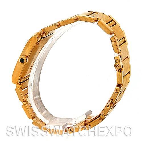 The image shows a side angle of a Cartier Tank Française watch, highlighting its gold bracelet and clasp.