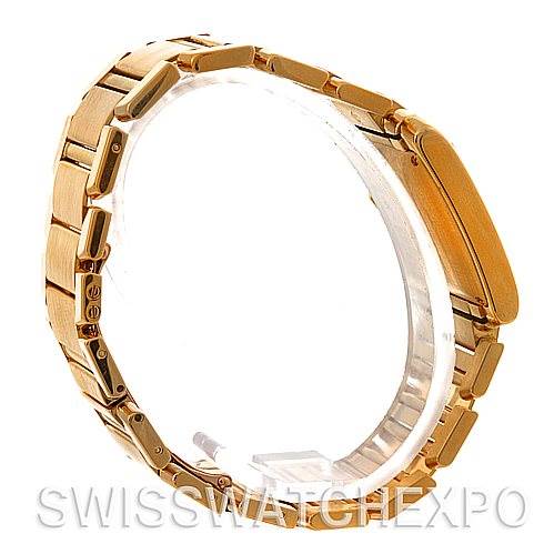 This Cartier Tank Francaise W50001R2 Men's Yellow Gold Silver Dial W50001R2 Men's Yellow Gold Silver Dial watch is shown from a side angle, highlighting its gold bracelet and case.