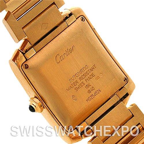 The image shows the back case and bracelet of the Cartier Tank Française watch, highlighting its inscriptions and construction.