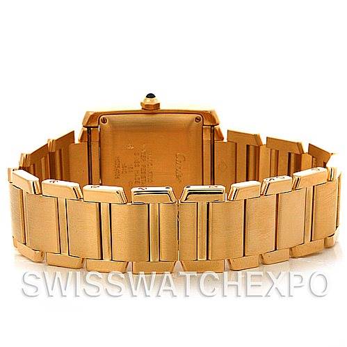 This image shows the back view of a Cartier Tank Francaise W50001R2 Men's Yellow Gold Silver Dial W50001R2 Men's Yellow Gold Silver Dial watch, focusing on the case back and part of the gold bracelet.
