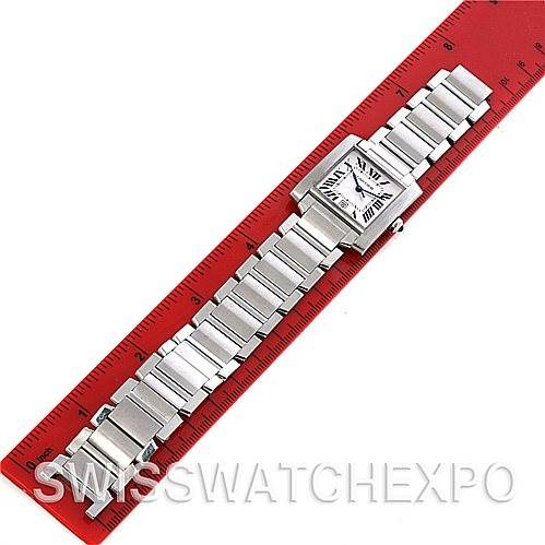 The Cartier Tank Francaise W51002Q3 Men
s Stainless Steel Silver Dial W51002Q3 Men
s Stainless Steel Silver Dial watch is shown flat with its face and full metal bracelet, beside a red ruler.