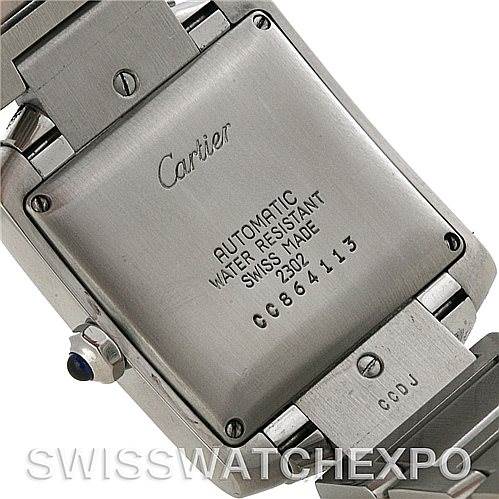 This image shows the back of a Cartier Tank Francaise W51002Q3 Men
s Stainless Steel Silver Dial W51002Q3 Men
s Stainless Steel Silver Dial watch, highlighting the brand markings, serial number, and part of the metal bracelet.