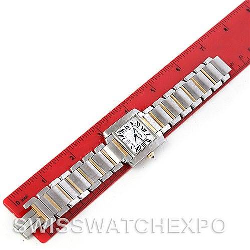 The Cartier Tank Francaise W51005Q4 Men's Steel and Gold (two tone) Silver Dial W51005Q4 Men's Steel and Gold (two tone) Silver Dial watch is shown from a top-down angle with a red ruler for scale.
