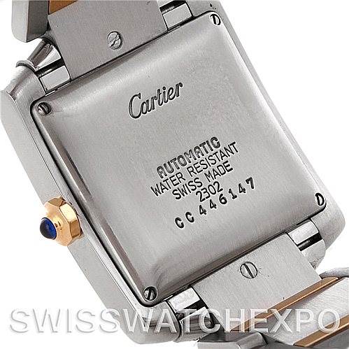 The image shows the back case of a Cartier Tank Francaise W51005Q4 Men's Steel and Gold (two tone) Silver Dial W51005Q4 Men's Steel and Gold (two tone) Silver Dial watch, highlighting its engravings and part of the gold and silver metal strap.