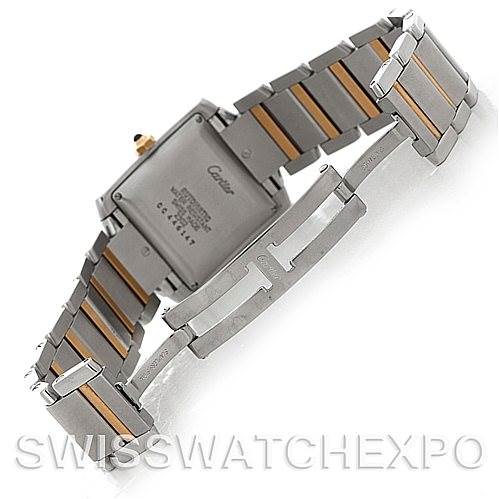 This image shows the back and part of the bracelet of a Tank Française model by Cartier at an angle, highlighting the clasp and links.