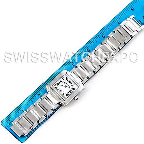 The image shows the top view of a Cartier Tank Francaise W51002Q3 Men
s Stainless Steel Silver Dial W51002Q3 Men
s Stainless Steel Silver Dial watch resting along a blue ruler, highlighting its square face and metal bracelet.