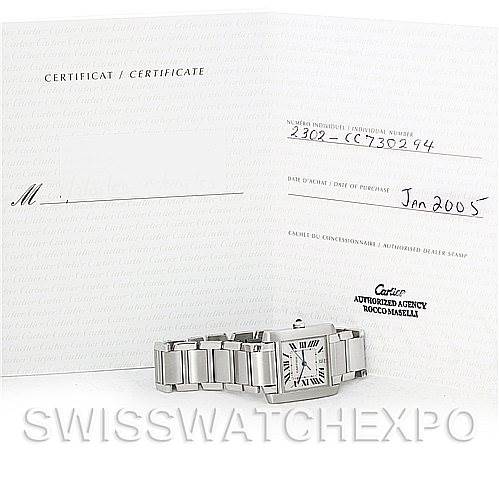 The image shows a Cartier Tank Francaise W51002Q3 Men's Stainless Steel Silver Dial W51002Q3 Men's Stainless Steel Silver Dial watch and its certificate, displayed at a slight angle from the front.