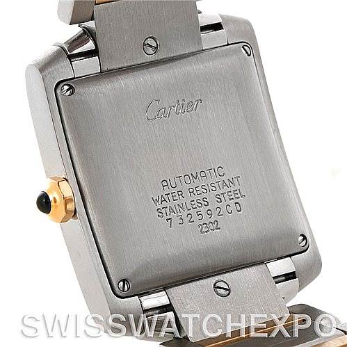 The image shows the underside of the Cartier Tank Francaise W51005Q4 Men's Steel and Gold (two tone) Silver Dial W51005Q4 Men's Steel and Gold (two tone) Silver Dial watch, highlighting the case back with engravings and part of the bracelet.