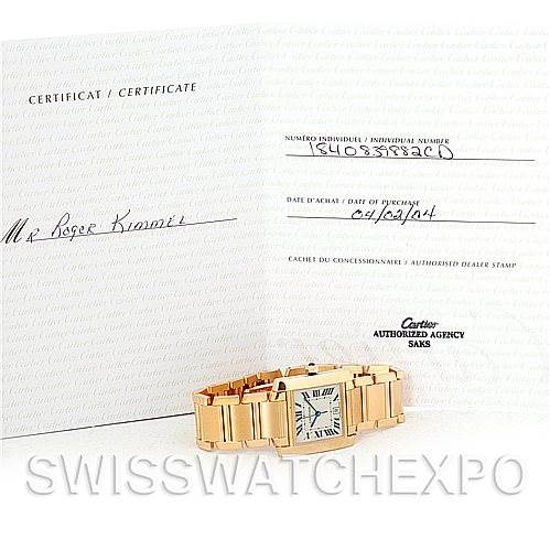 The image shows a Cartier Tank Francaise W50001R2 Men's Yellow Gold Silver Dial W50001R2 Men's Yellow Gold Silver Dial watch with its certificate and guarantee card displayed behind it.