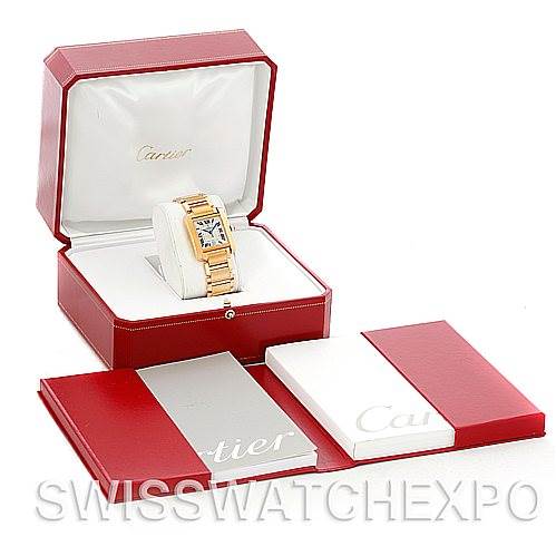 The image shows a Cartier Tank Francaise W50001R2 Men's Yellow Gold Silver Dial W50001R2 Men's Yellow Gold Silver Dial watch in its open box with accompanying booklets laid out beside it.